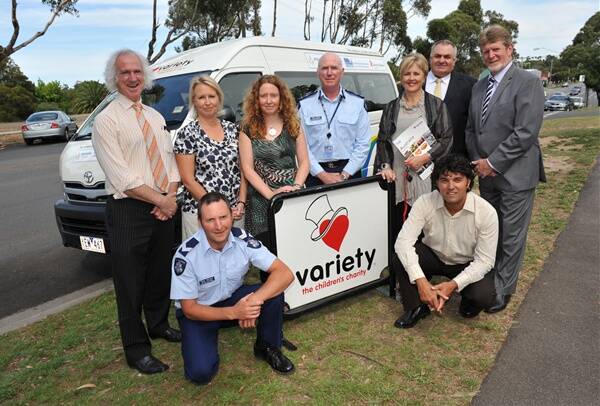 taking delivery: Mayor Rod Fyffe, Sandra Hamilton (Department of Education), Leanne Nicholson (Save the Children), Police Superintendent Daryl Clifton, Anne Henshall (Variety), Norm Hutton (CEO Variety Victoria), Bob Jones (Freemasons Victoria), and, front, Leading Senior Constable Peter Bullock and Vern Hardie (Operation Newstart). Picture: Julie Hough
