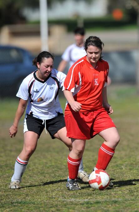 Spring Gully’s Carrie Lenaghan and City’s Jennifer Suzuki.
