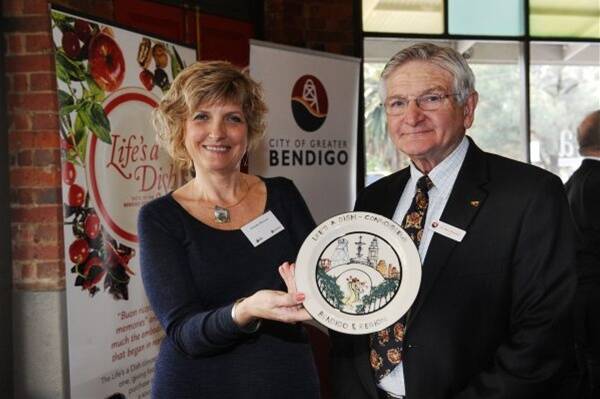 PERFECT TASTE: Claudia McLean and City of Greater Bendigo Mayor Alec Sandner at the launch of Life’s a Dish at La Piazza. Picture: Julie Hough
