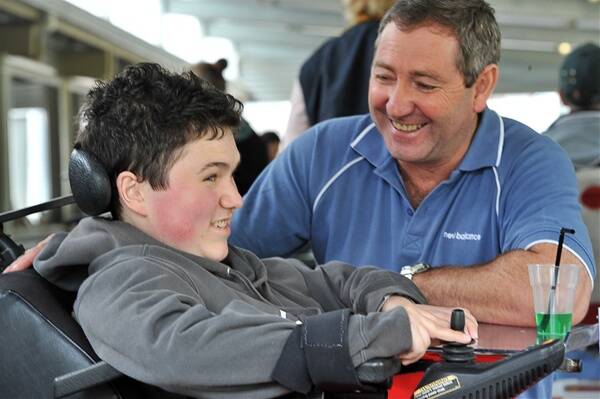 HELPING HAND: Dominic Di Battista, 18, with carer Ken Forbes.