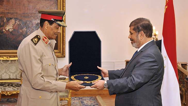 New broom … President Mursi sees off the former military commander Field Marshal Mohammed Hussein Tantawi, this week.