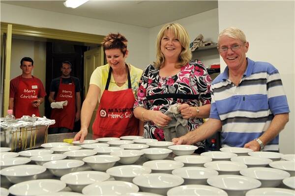 Sue Spencer, Lynn Southwell and David Patterson help out at the Christmas lunch.