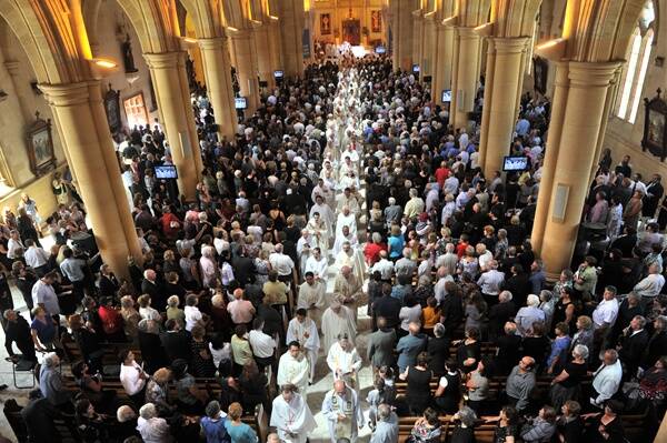 LAST RESPECTS: The Sacred Heart Cathedral was overflowing. Those attending included a large contingent from the Maltese community and more than 200 bishops and priests from across Australia.