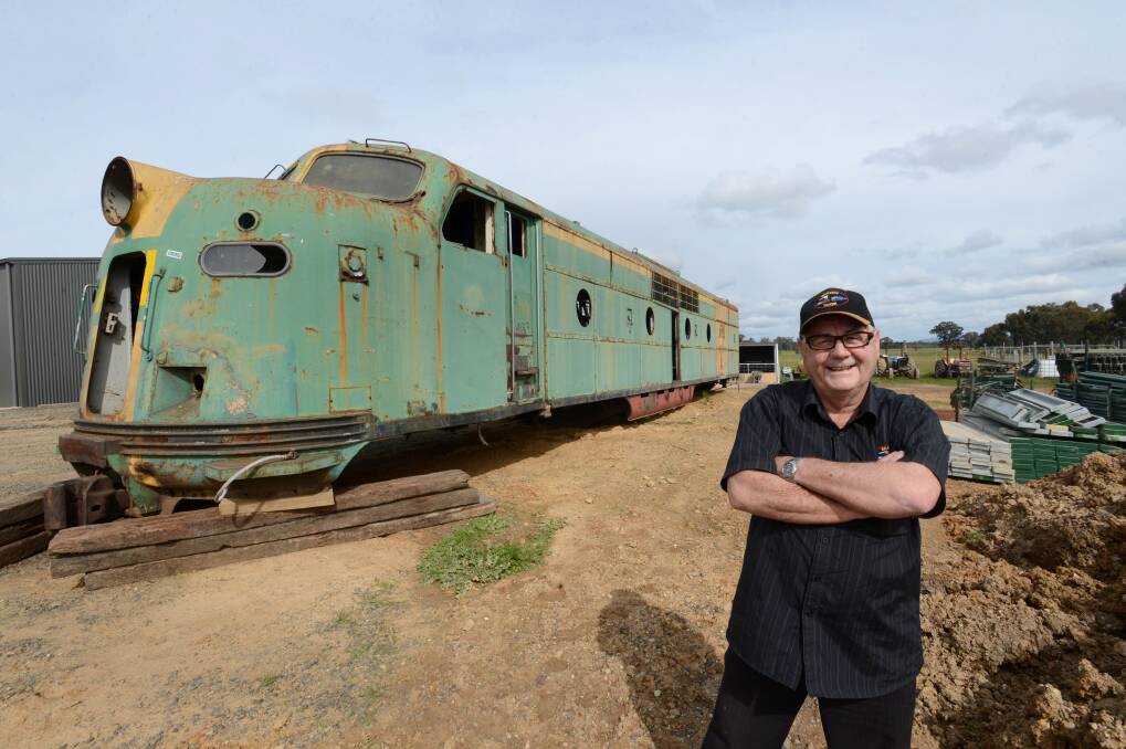 Bob Braidie with GM25 locomotive he plans to transform into a bar for his beer garden in Braidie’s Tavern. Photo: JIM ALDERSEY