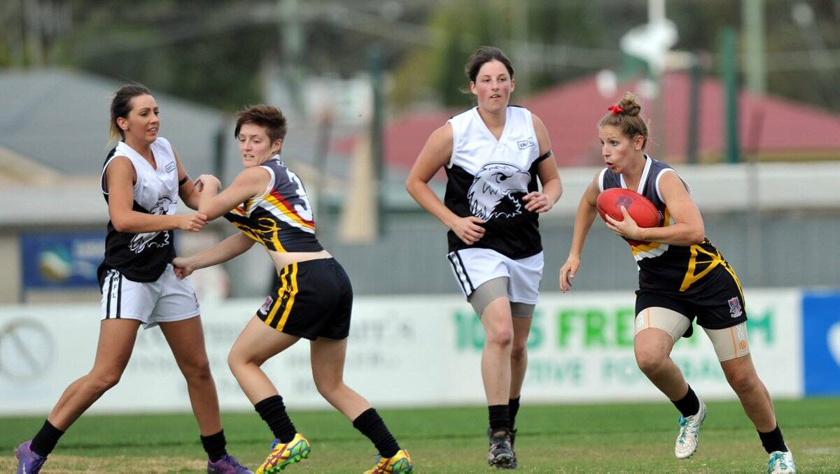CLASS PLAYER: Bendigo Thunder's Emma Grant charges through the midfield in this season's battle with Ballarat at Beck Legal Oval in Kangaroo Flat. 