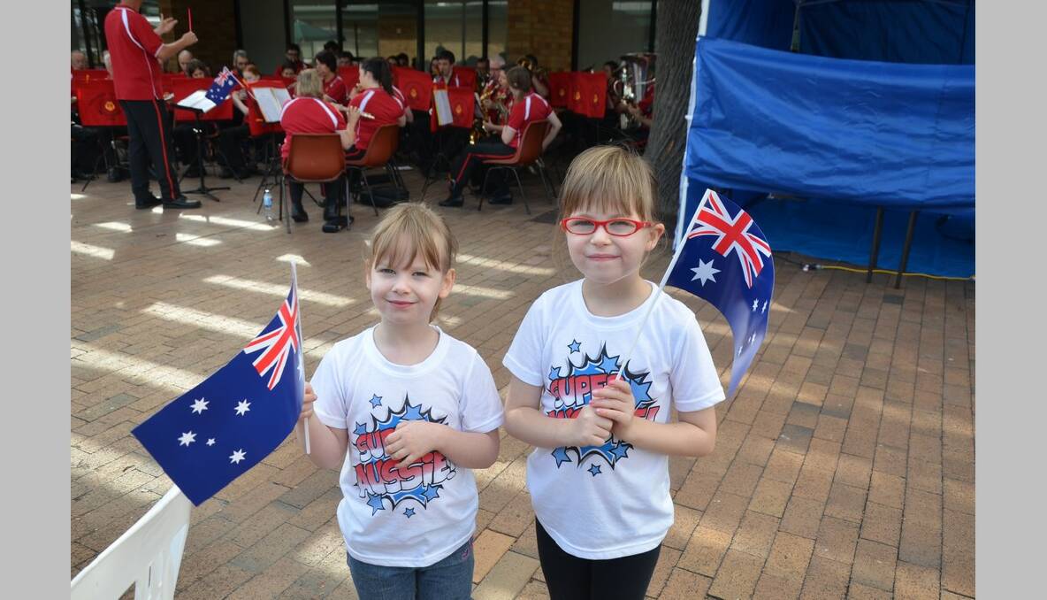 Ruth and Rachel Bock wave their Australia Day flags at Singleton's celebration.