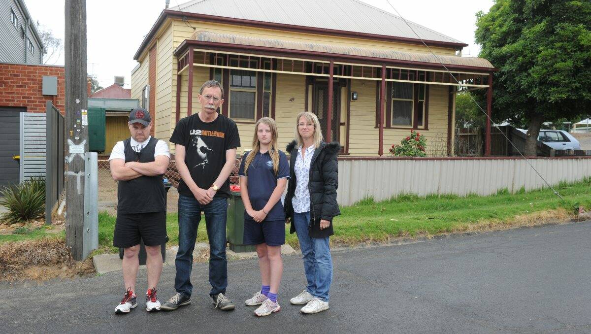 SAD: Residents Daniel Williams, John Morton, Stephanie Trew and Sharon Morton in front of the mayor’s house in Little Breen Street which was approved for demolition by City of Greater Bendigo councillors this week. Picture: Peter Weaving