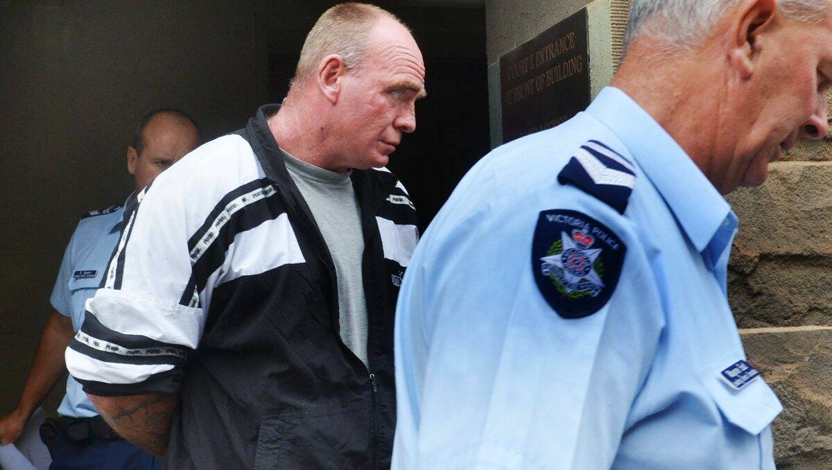 TO STAND TRIAL: Allen Anderson is led from Bendigo Magistrates Court yesterday.