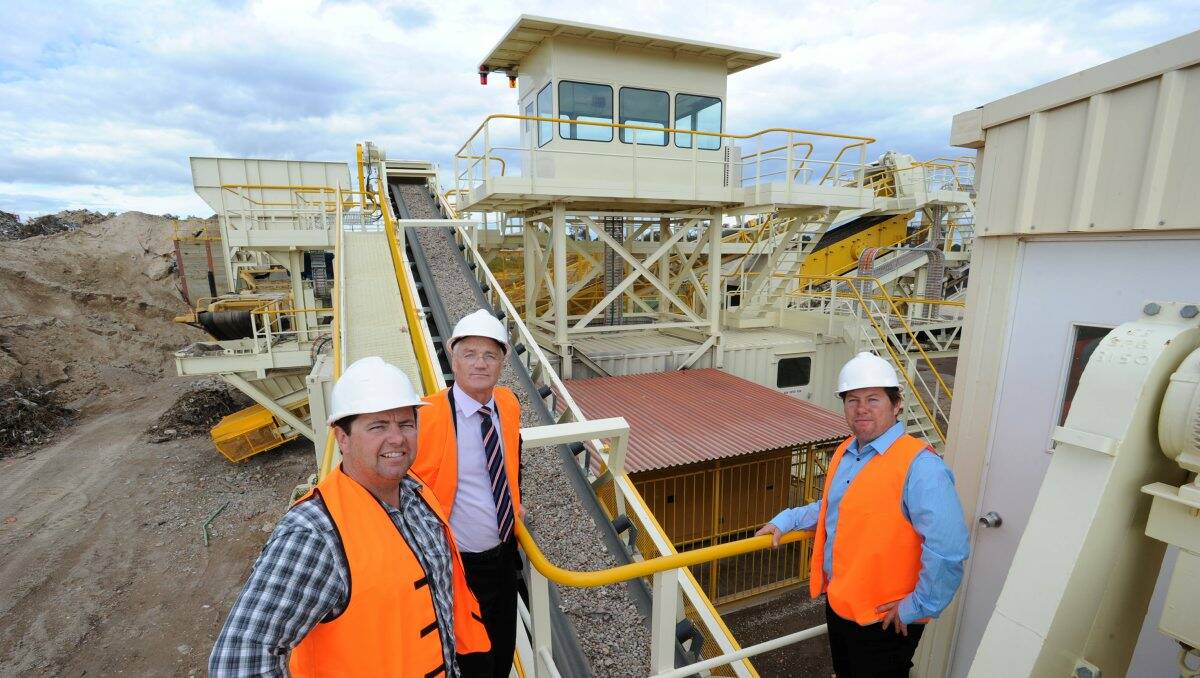 Moving up: Member for Northern Victoria Damian Drum (centre) at the unveiling of new crushing machinery at Hopley Recycling in White Hills with operators Blair (left) and Justin Hopley.