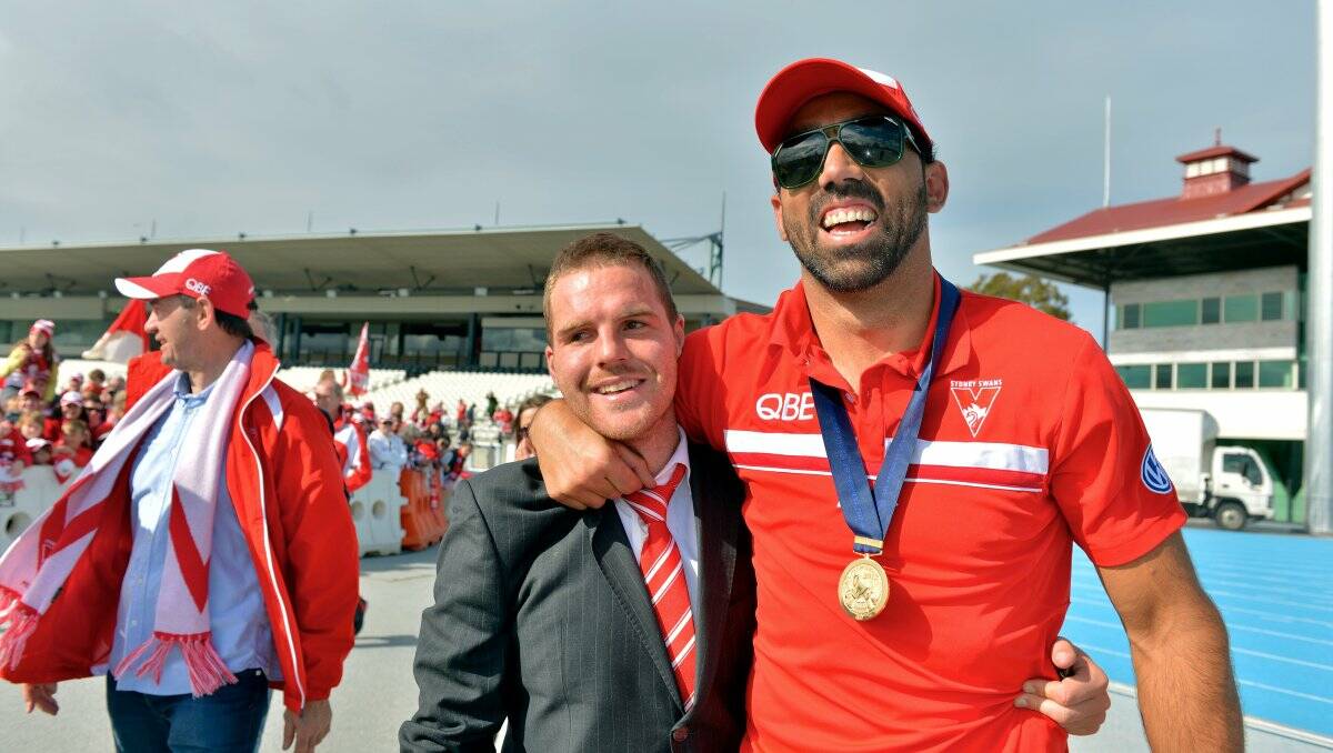 ENJOYING THE MOMENT: Ben McGlynn and Sydney Swans co-captain Adam Goodes at Lakeside Oval. Picture: FAIRFAX