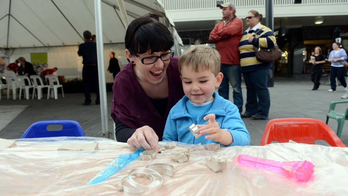 active: Claire and Tobias Sexton, 3, playing with clay at the launch of the Prevention Community Model. Picture: Jim Aldersey