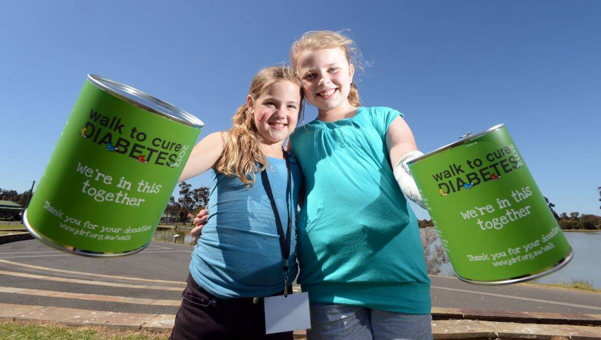 ALL-STARS: Bridget Johns, 8, and Imogen Yeates, 10, together raised more than $12,000 for diabetes research through Bendigo’s first Walk to Cure Diabetes held at Lake Neangar yesterday. Picture: Jim Aldersey