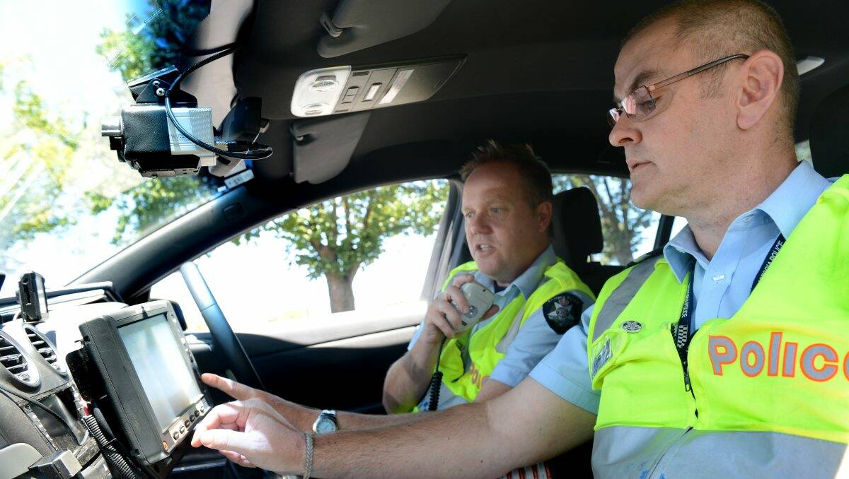 TEST DRIVE: Leading Senior Constables Peter Henry and Kelvin James from the highway patrol try out the prototype vehicle. Picture: JULIE HOUGH