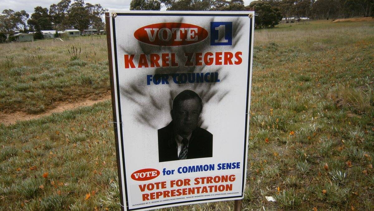 Defaced: Karel Zegers has offered a reward to help find the vandal or vandals who destroyed his campaign signs. Picture: CONTRIBUTED
