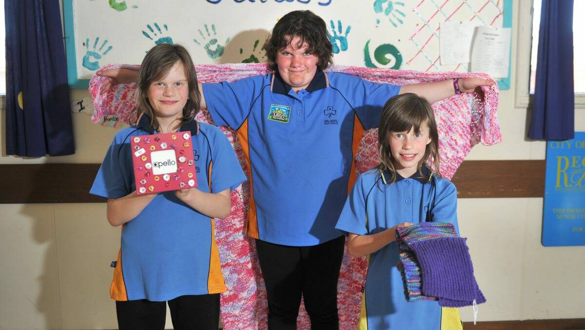 HAND-MADE: Girl Guides Lisa Dawson, Tatjana Johns-Dunlop and Kylie Dawson with some of the items that will be sold at the craft market today. Picture: Jodie Donnellan