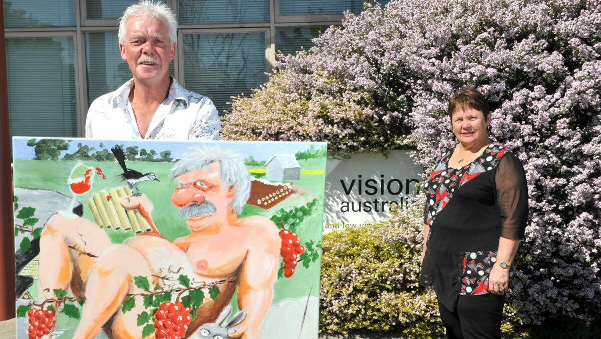 GOOD CAUSE: Ross Lougoon from Connor Park Winery with his painting Back to the Future, which will be auctioned for charity on Friday, and Vision Australia Bendigo manager Ruth O’Connell. Picture: Jodie Donnellan