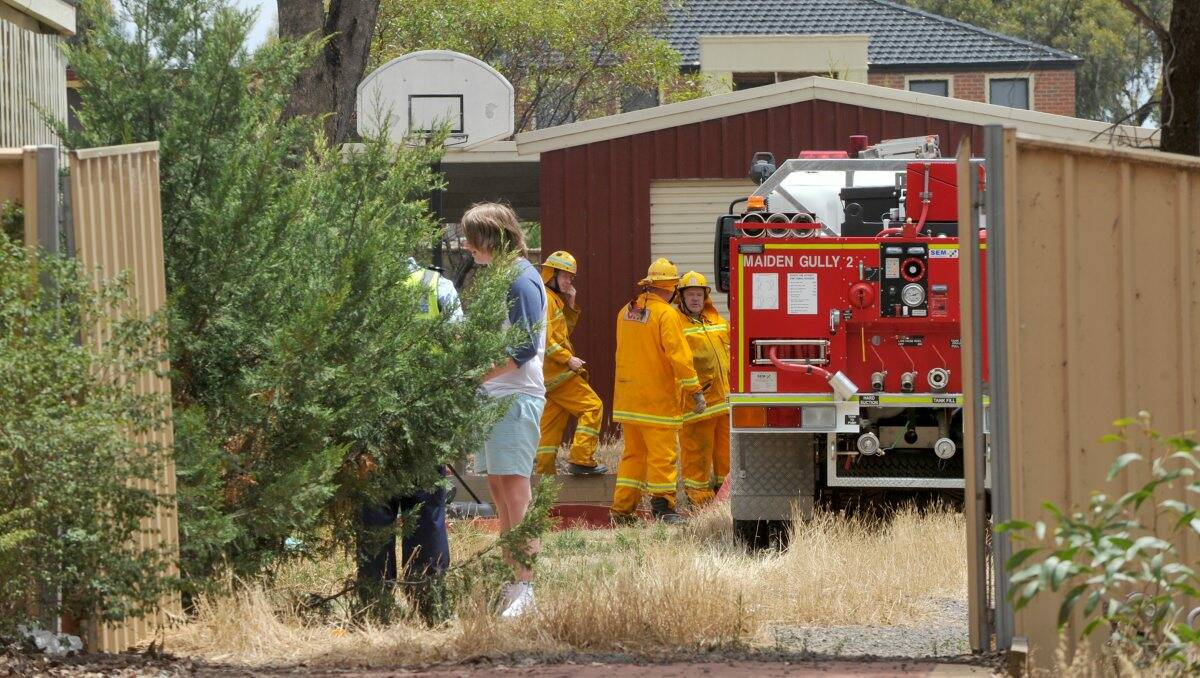 Contained: CFA members at the scene of the fire. Picture: JODIE DONNELLAN
