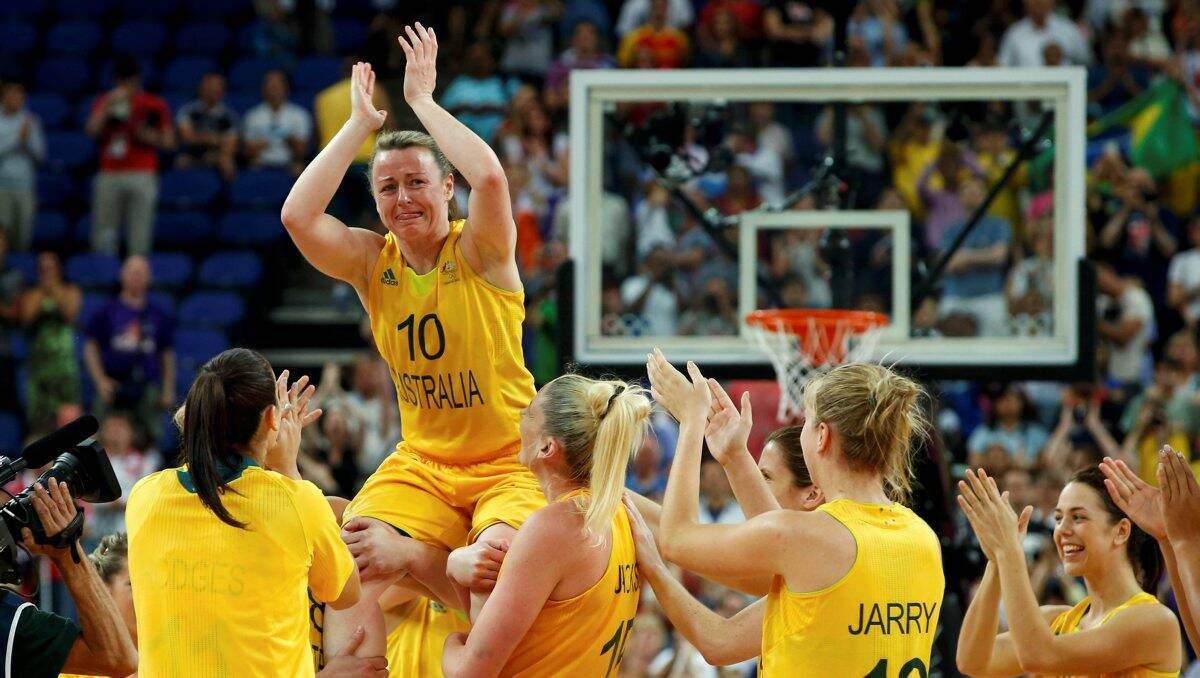 FITTING FINISH: Bendigo’s Kristi Harrower is cheered by team-mates as she is chaired off after her final match for the Opals. Picture: REUTERS