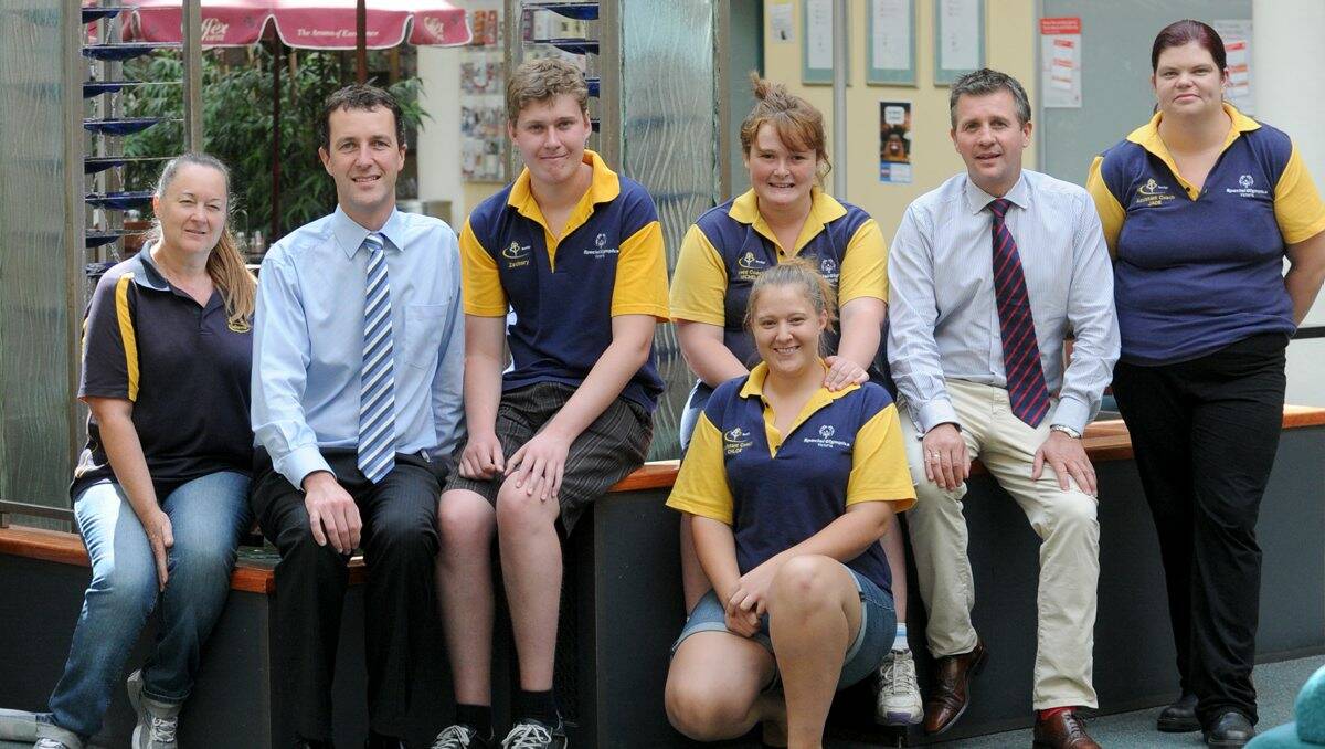 Working together: Bendigo Barracudas coach Michelle Bearryman-Cooper, St John of God director of mission Denis Byrne, swimmers Zac and Georgie, coach Chloe Cooper, St John of God chief executive Darren Rogers and coach Jade Henderson in St John of God Hospital’s Atrium.  Picture: Jodie Donnellan