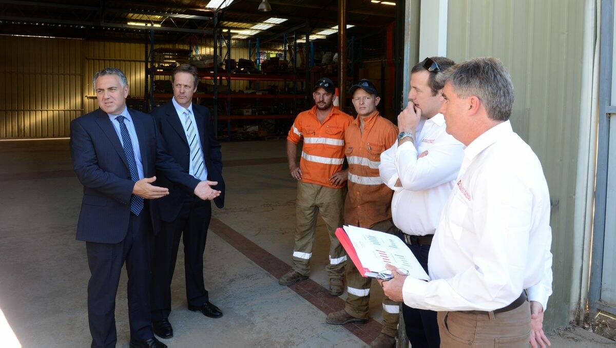 WEIGHING IN: Shadow treasurer Joe Hockey and Liberal candidate for Bendigo Greg Bickley chat to Aaron Miller, Nathan Rule, Vaughan Cullen and Richard Maish from Australian Mineral and Waterwell Drilling at the company’s Epsom site.  Picture: JIM ALDERSEY
