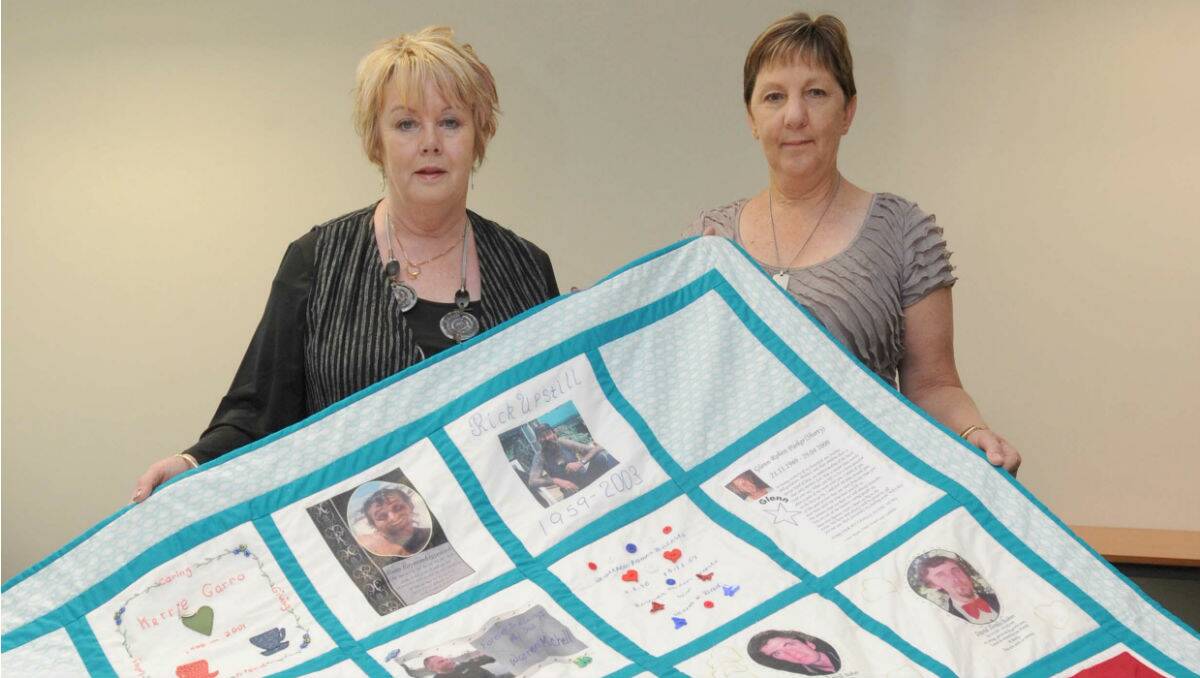MEMORIAL: Bette Phillips and Alannah McGregor with the hand-crafted quilt. Picture: Jodie Donnellan