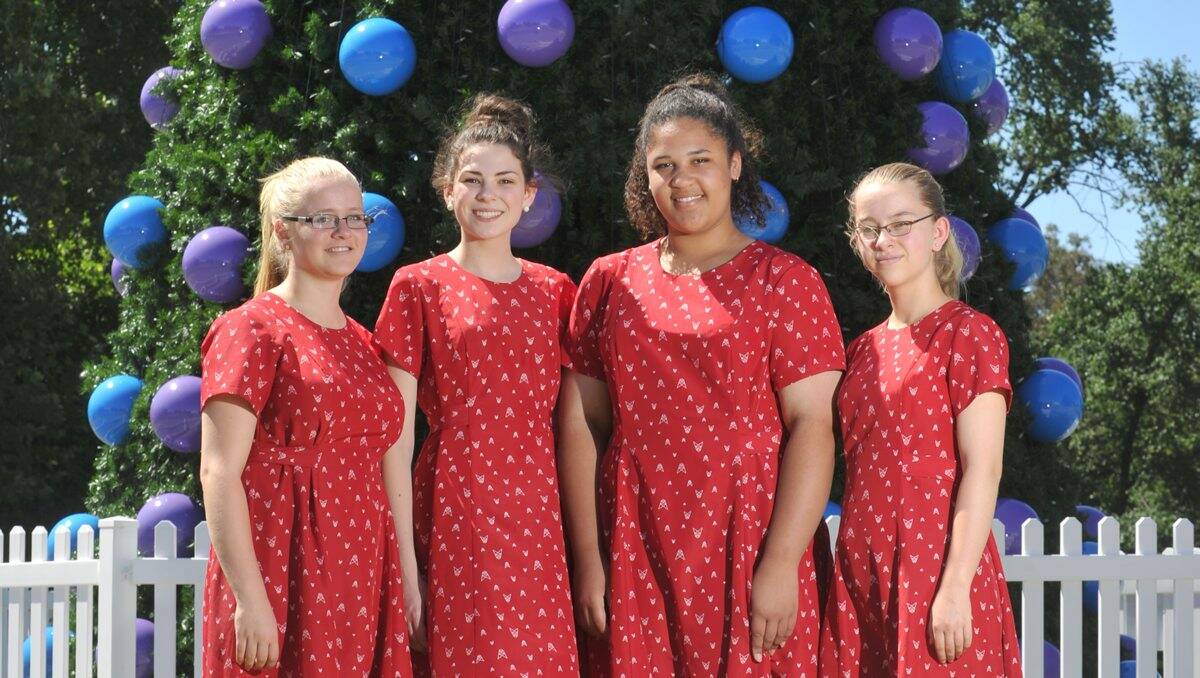 Festive: Elizabeth Stoel, Grace Phillips, Georgia Watson-Jones and Hannah Stoel from the Bendigo Youth Choir will perform at the carols tomorrow night. Picture: Jodie Donnellan