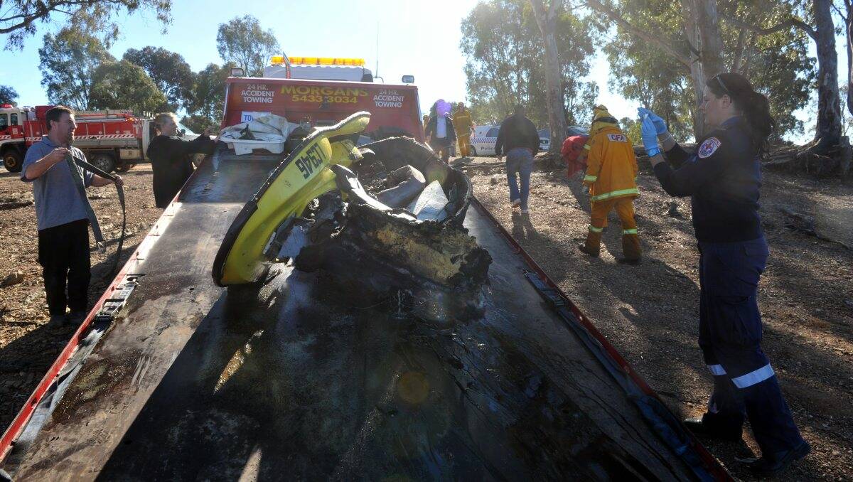 The wreckage of the jet ski is removed from Lake Eppalock on Saturday. Picture: Julie Hough