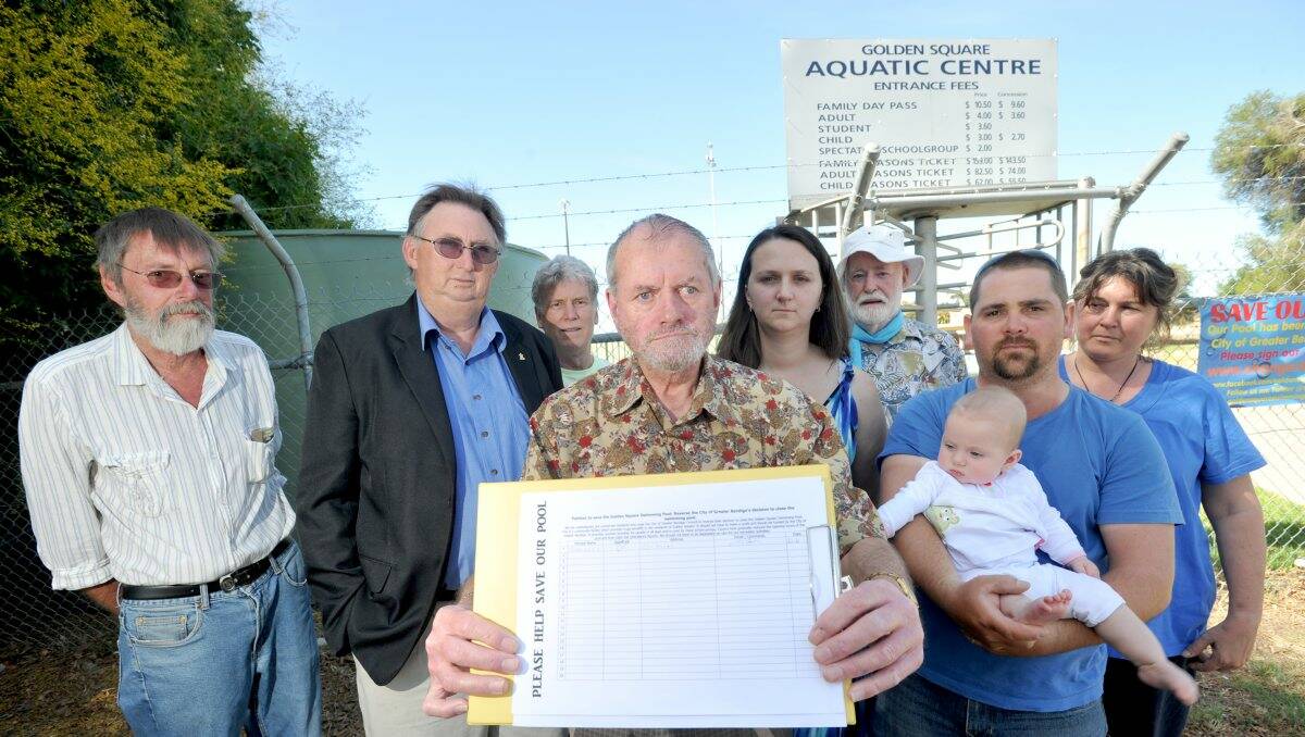 CAUSE: Save the Golden Square Swimming Pool group members Jim McCarthy, Andrew Penna, Ken Hamilton, Tony Dillion, Londa Howell, Bill Collier, Shane Howell with five-month-old Emily, and Michelle Jones. Picture: JODIE DONNELLAN