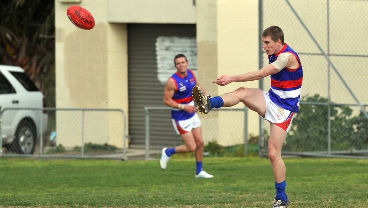 RELIABLE DEFENDER: Gisborne's Cameron Medica clears from the backline in the round 17 clash at Golden Square. 