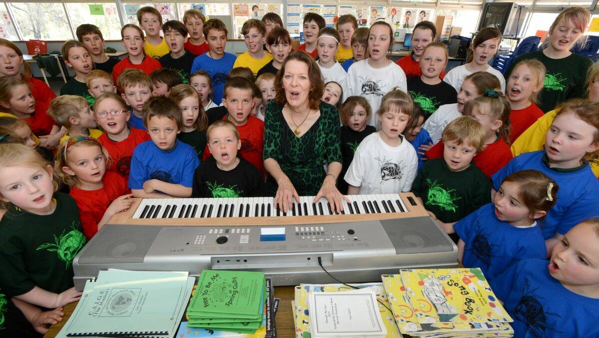 IN TUNE: Music teacher Gail Godber with Spring Gully Primary School prep students and senior cast members from the upcoming musical. Picture: JIM ALDERSEY