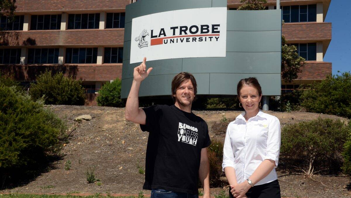 Team effort: Leigh Turner from Bendigo for Homeless Youth with Bendigo Community Telco marketing manager Kylie Kaye congratulated La Trobe University on its silent auction win. Picture: Jim Aldersey
