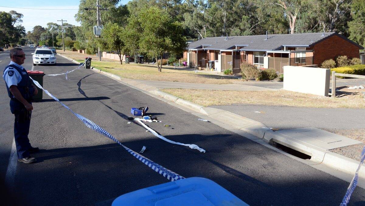 No entry: Police tape seals off the area where the stabbing took place in Retreat Road, Spring Gully. Picture: Jim Aldersey