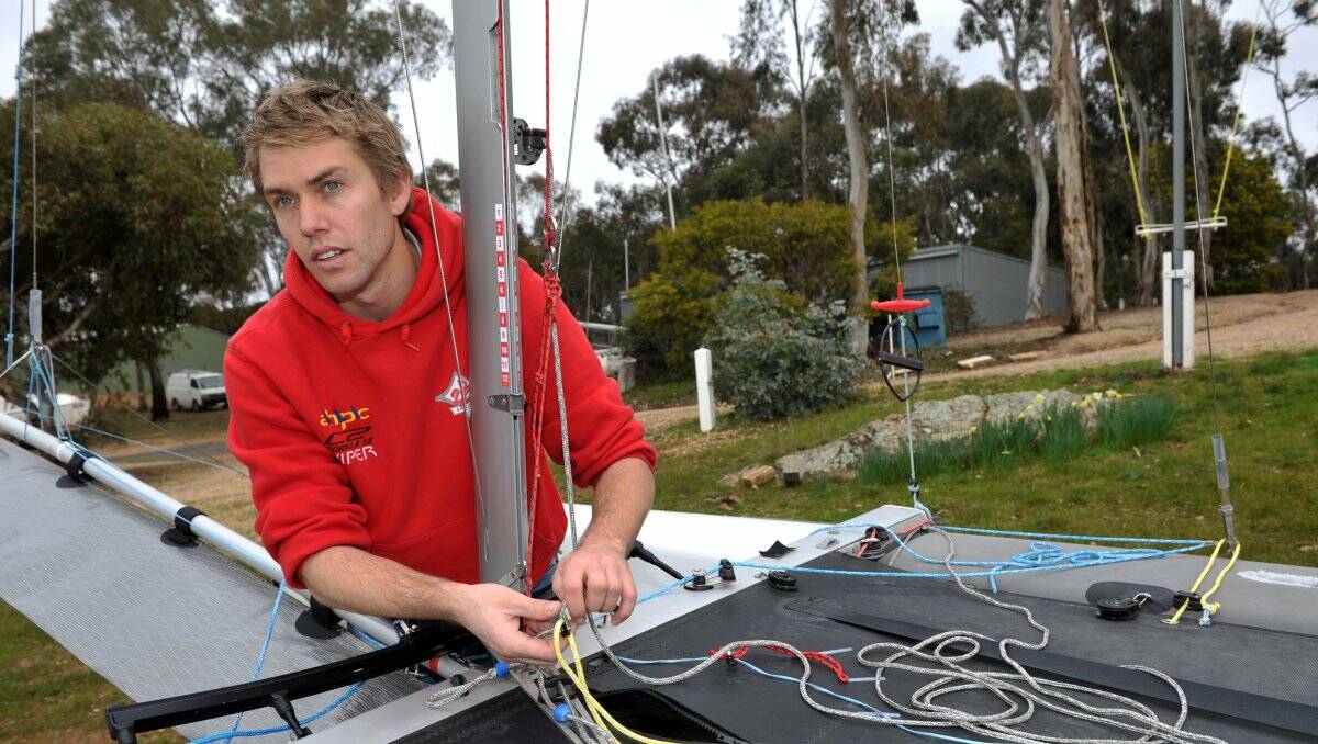 TOP CONTENDER: Bendigo's Brett Goodall , who starred in racing off Los Angeles, checks his rigging before a training session on Lake Eppalock. Picture: JULIE HOUGH 