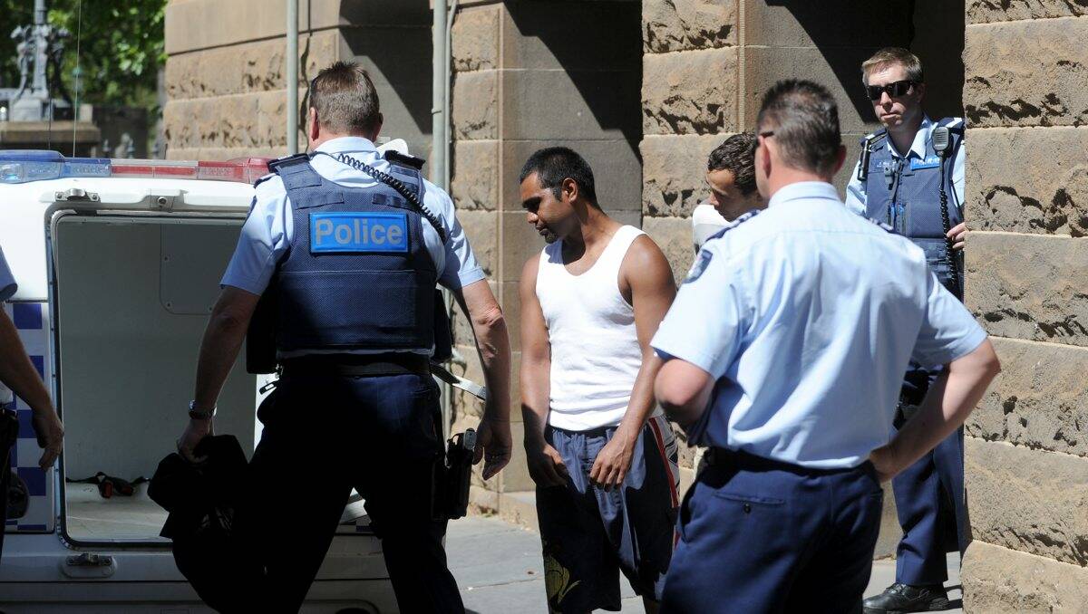Remanded: Trent Harrison and Thomas Johnson are led from Bendigo Magistrates Court. 
