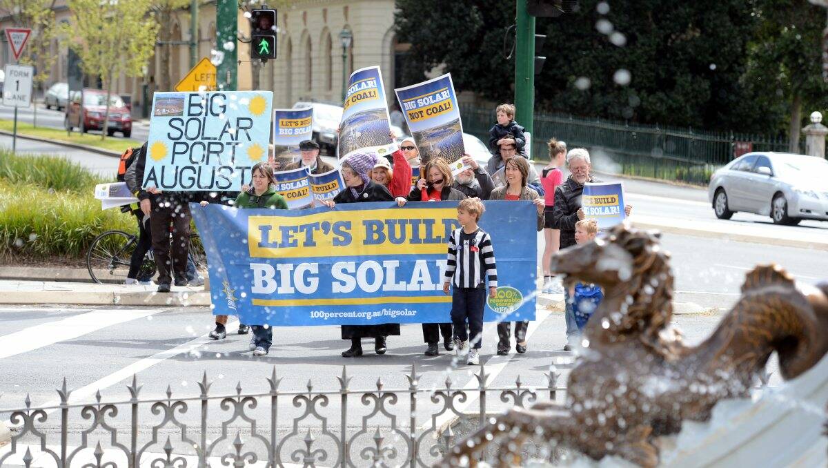 Message: The Bendigo Sustainability Group walks through Charing Cross en route to Steve Gibbons’ office. Picture: Jim Aldersey