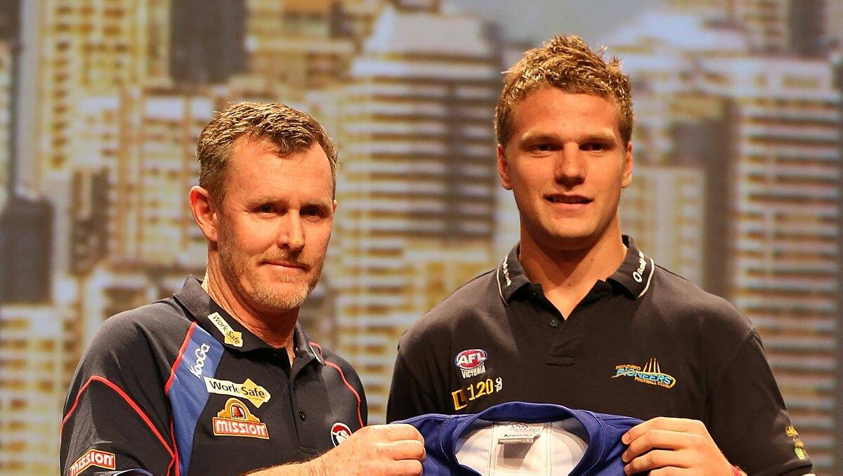 WELCOME: Bulldogs coach Brendan McCartney with Jake Stringer. Picture: GETTY