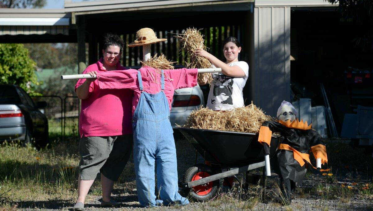 COMPETITORS: Jenny and Sofia Leat with some of the scarecrows they have made for the Bendigo show. Picture: JIM ALDERSEY