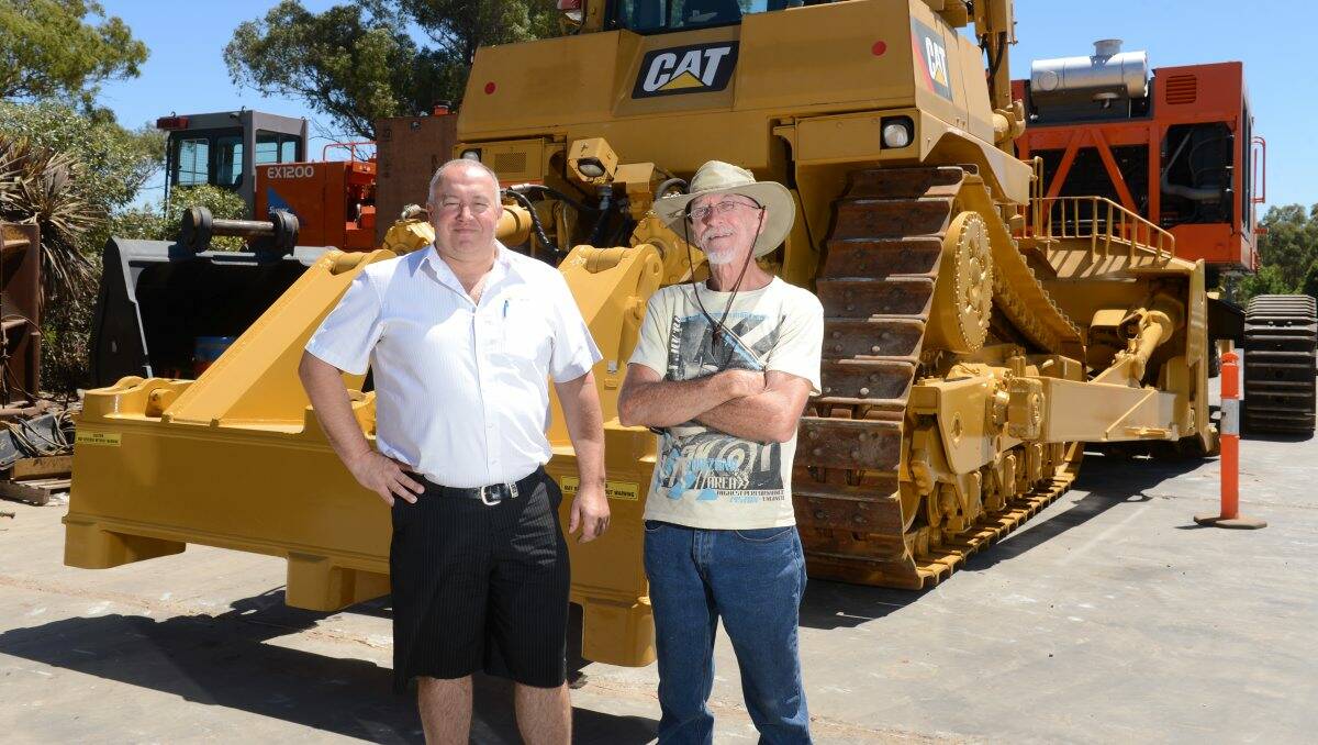 RAPT: Managing director of Andy's Earthmoving Andy Hoare with new employee Midge Holman a job. Picture: JIM ALDERSEY