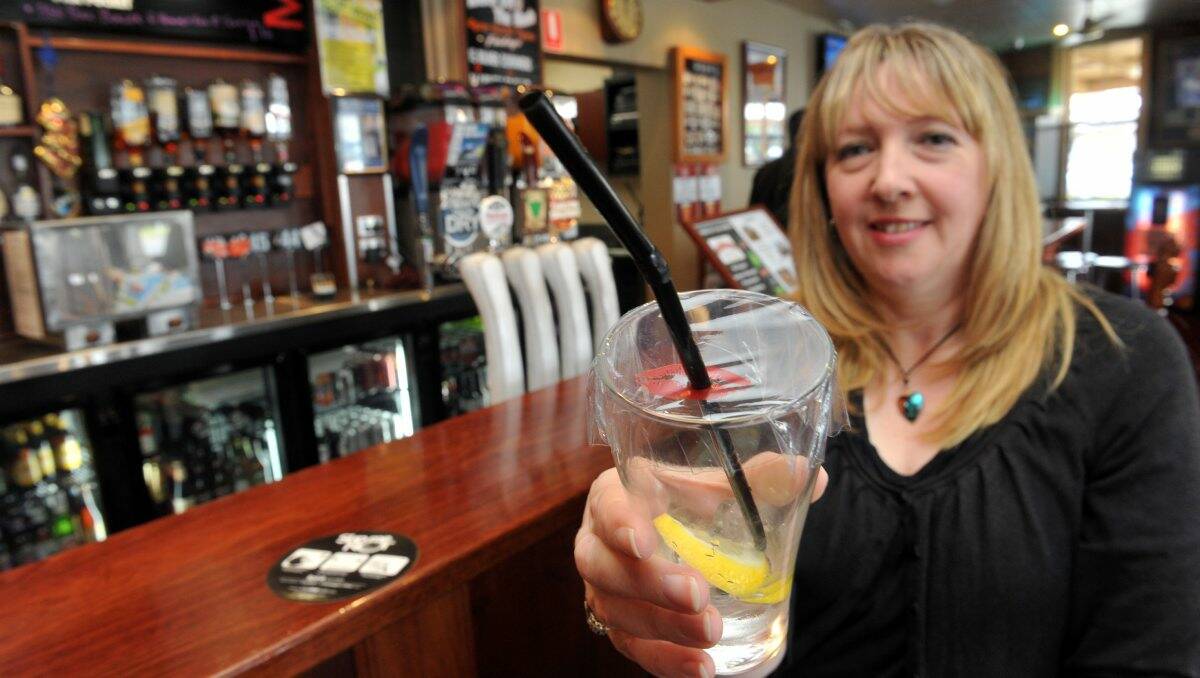 INNOVATIVE: Michelle Hoffman has invented a plastic cover called “Slip me not” to protect drinks against drink spiking. Picture: Julie Hough