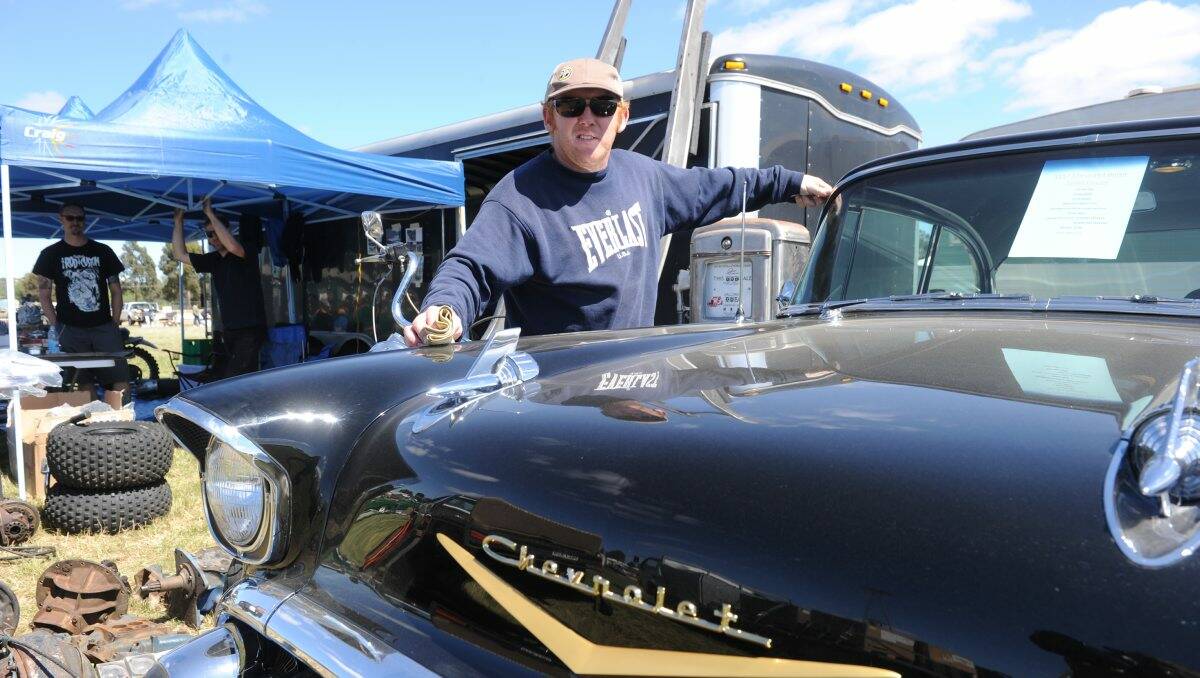 SHINY: Troy Medlen from Adelaide with his 1957 Chevrolet sports coupe. Picture: PETER WEAVING