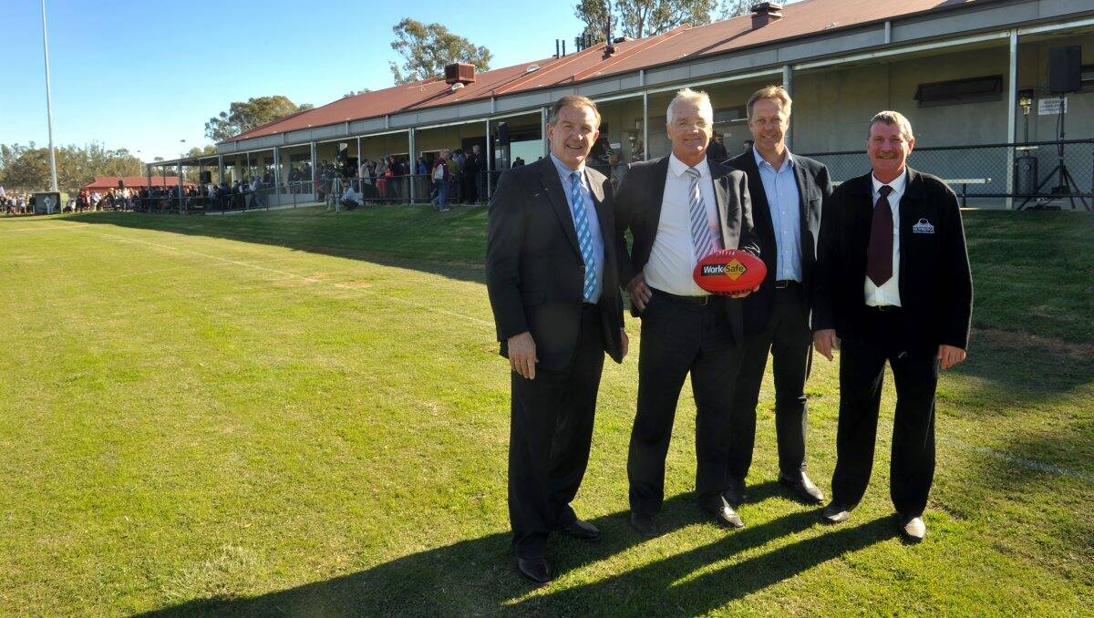 RE-OPENING: Minister for Sport Hugh Delahunty, MLC Damian Drum, Liberal candidate for Bendigo Greg Bickley and Newbridge Football and Netball Club president Ron Trimble. Inset, the reserve after the 2011 floods. Picture: JULIE HOUGH