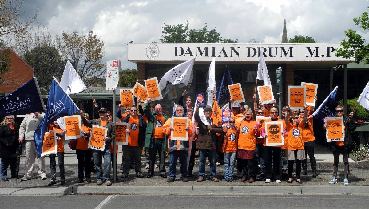 taking a stand: Protesters rally outside Damian Drum’s Barnard Street office yesterday.Picture: Hannah Knight