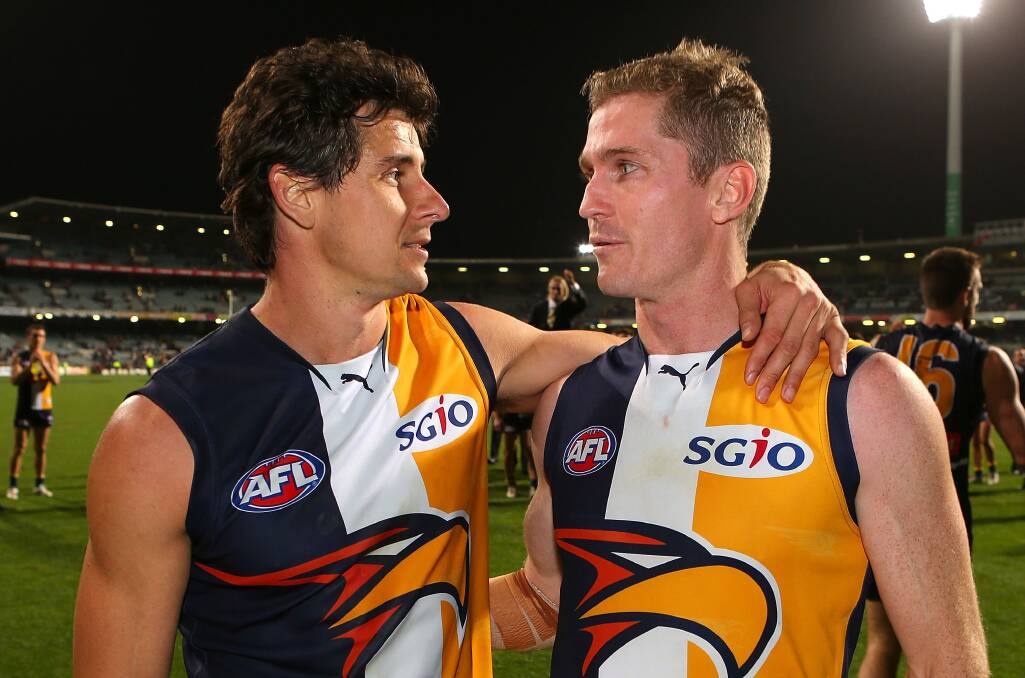 Andrew Embley and Adam Selwood leave the field after playing their final games for the West Coast Eagles last month. Picture: GETTY IMAGES.