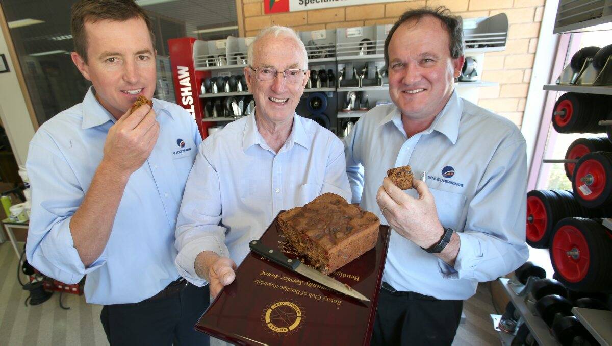 WELL-EARNED: Bill Robertson, Graeme Chellew and Trevor Nancarrow enjoy some Christmas cake. Picture: PETER WEAVING