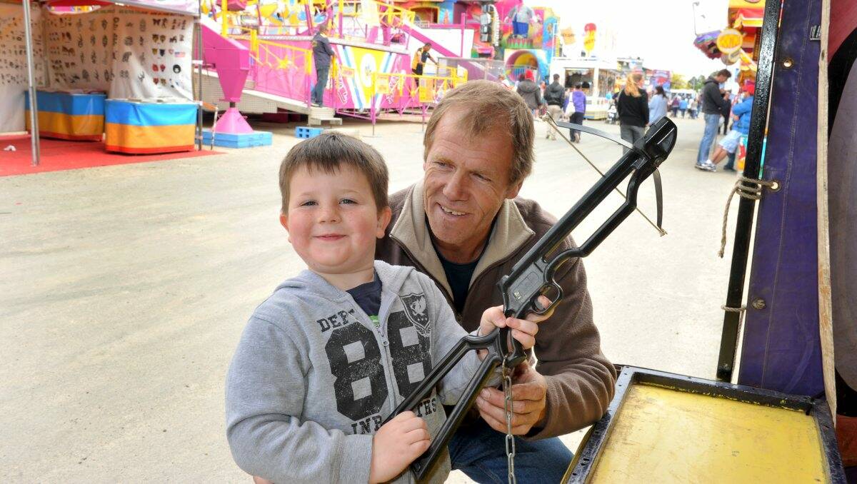 Graham Kennedy and his grandson Riley test their skills on the games at the Bendigo Show.
