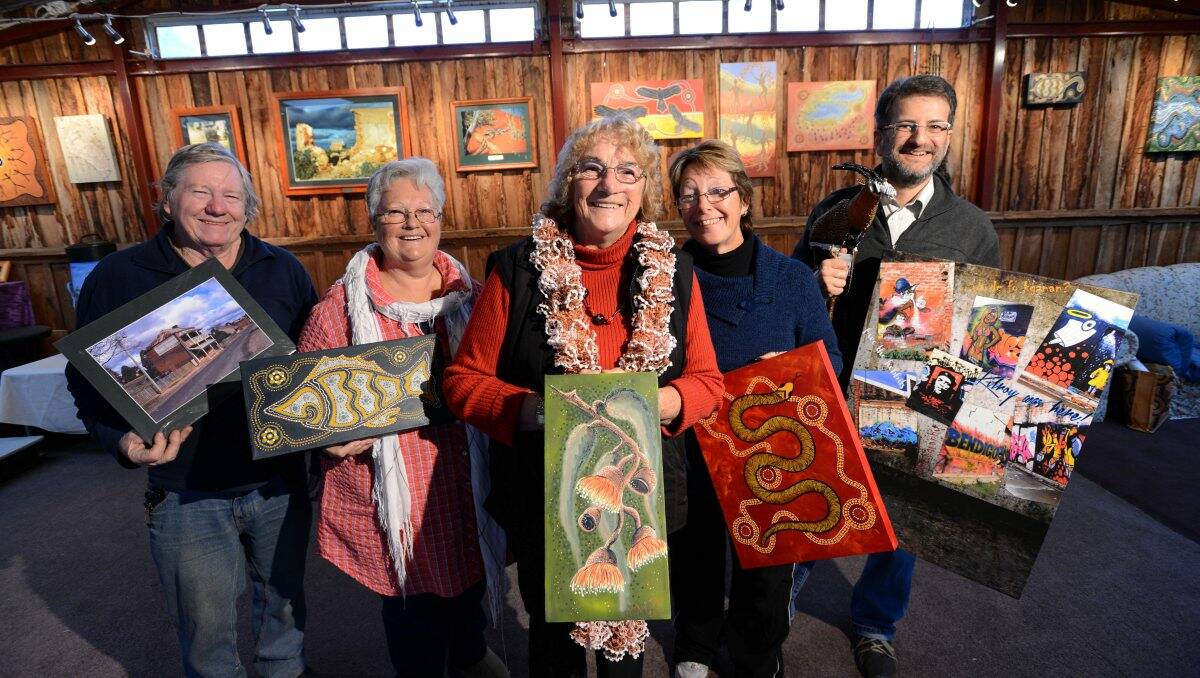 Bill Whitbread, Reverend Robyn Davis, Georgie Jackson, Trina Oogjes and William Kok show off their paintings. Picture: JIM ALDERSEY