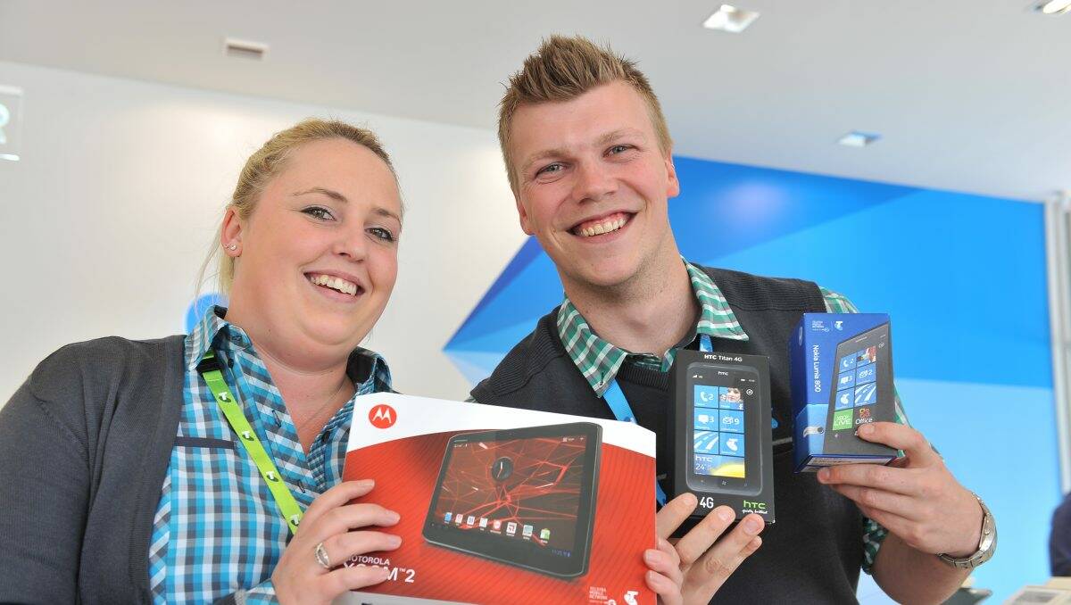 HOT PROPERTY: Rebecca Veith and Brodie Nicholls with the Telstra Hot 100 prizes. Picture: Brian Semmens