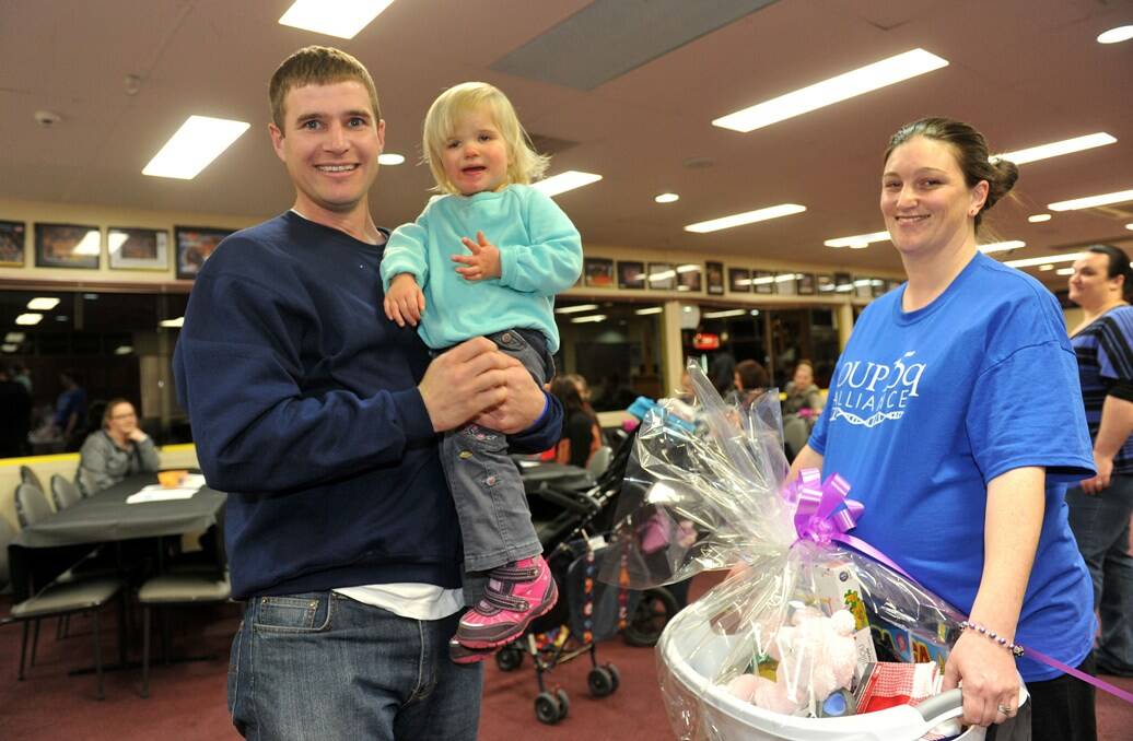 Chris Medlyn and Anne Tiplady with their daughter Evie Medlyn at the fund-raiser. Picture: Julie Hough