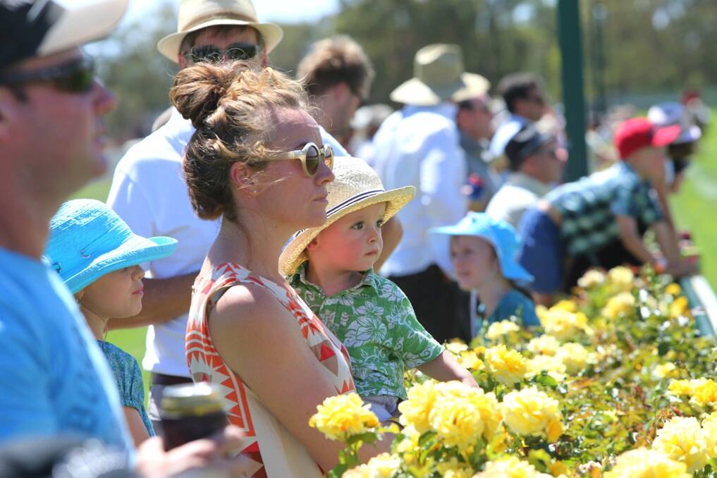 Julie Anne Russell watches a race with her son Jeremiah O'Sullivan.