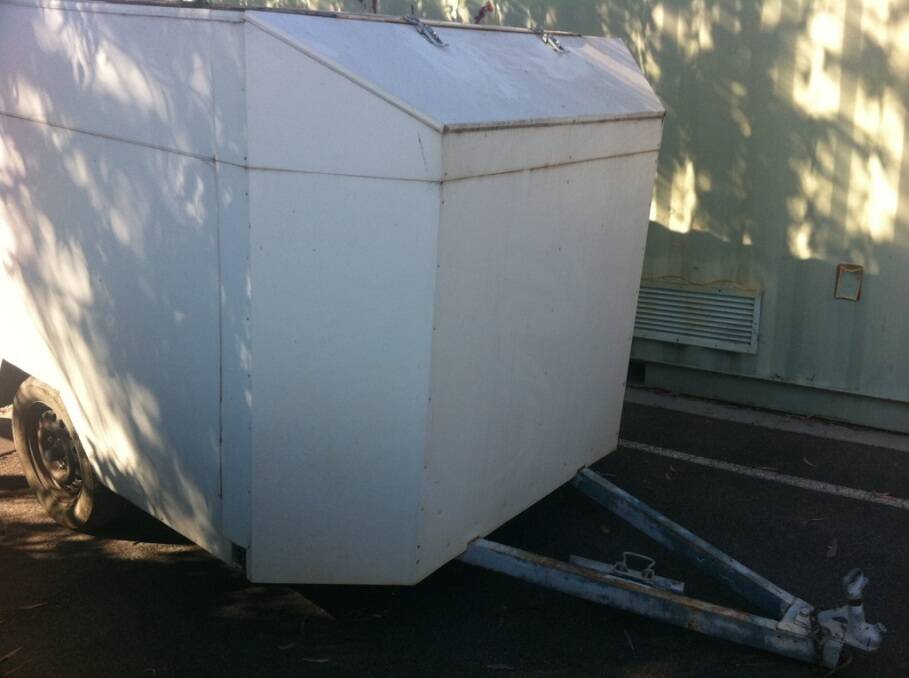 Police are searching for the owner of this white trailer.